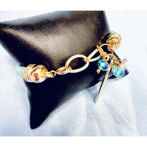 Unsigned Metallic Aqua Mesh Cord with Gold Tone End Caps with Charms Bracelet